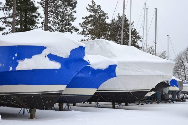 Shrink,Wrapped,Boats,Covered,With,Snow